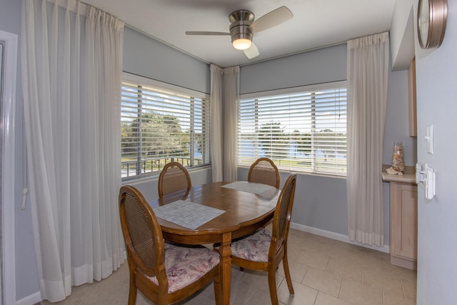 tiled dining room with ceiling fan