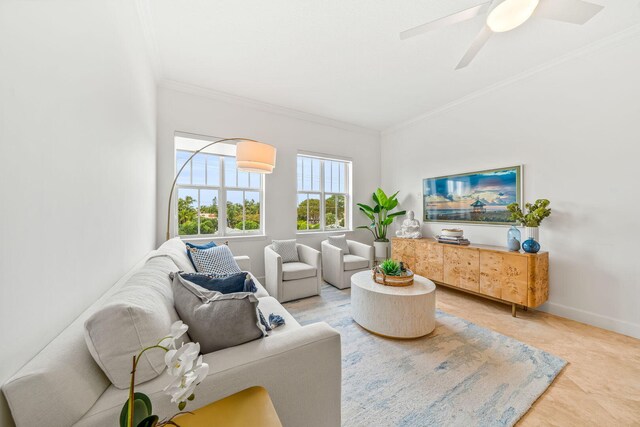 living room featuring ceiling fan and crown molding