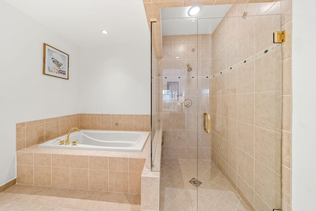 bathroom with tile patterned flooring and plus walk in shower