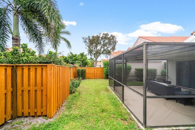 view of yard with a lanai