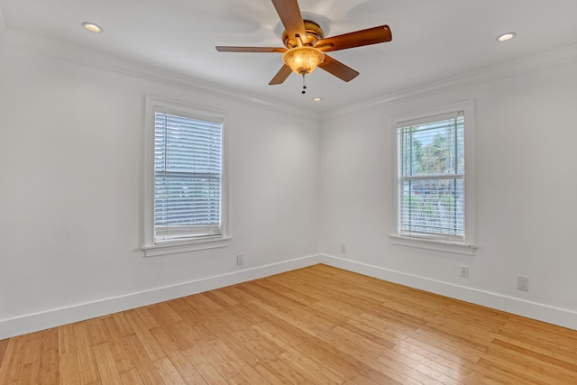 empty room with ceiling fan, ornamental molding, and light wood-type flooring