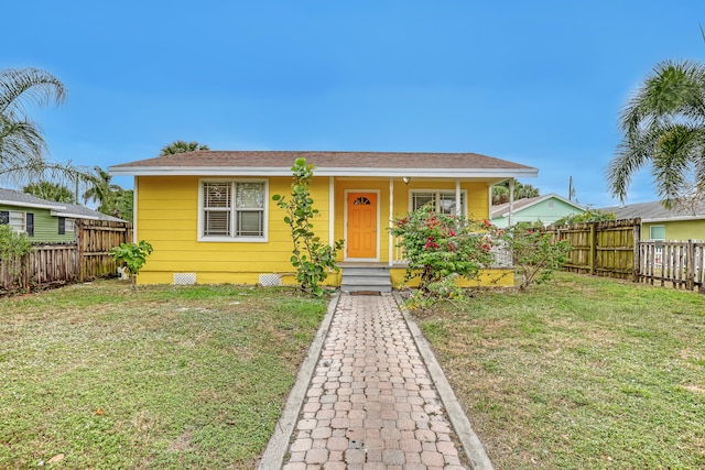 bungalow-style home featuring a porch and a front lawn