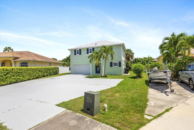 view of front facade with a garage and a front lawn