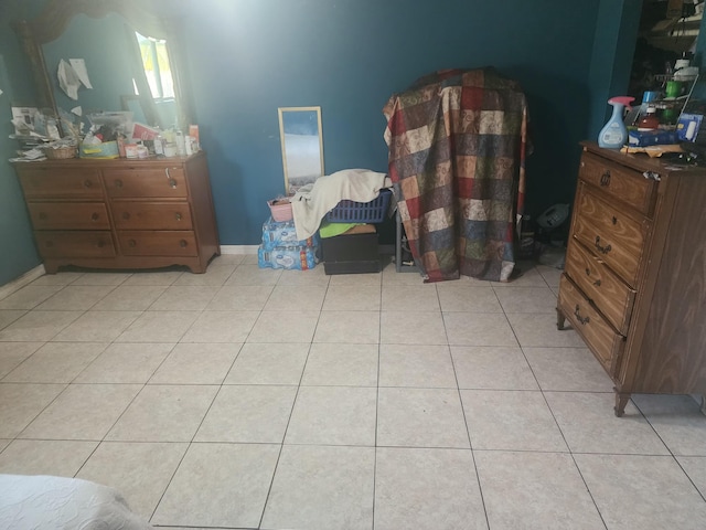 bedroom featuring light tile patterned floors