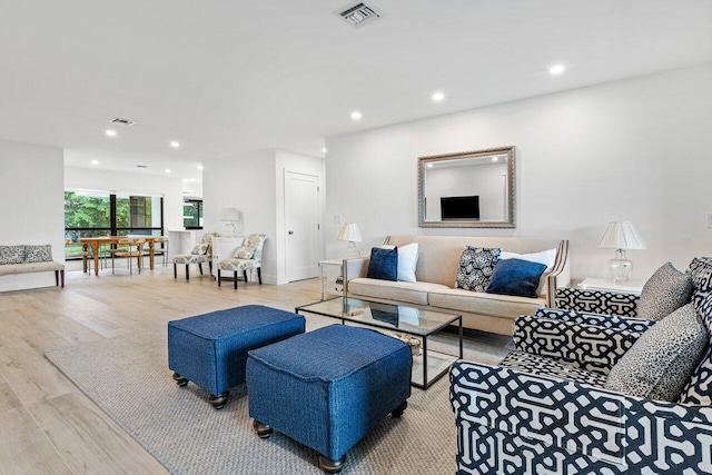 living room with light hardwood / wood-style floors