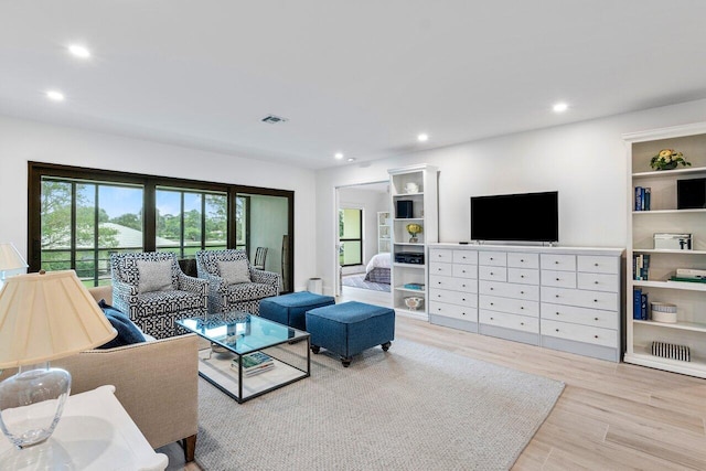 living room with light hardwood / wood-style floors