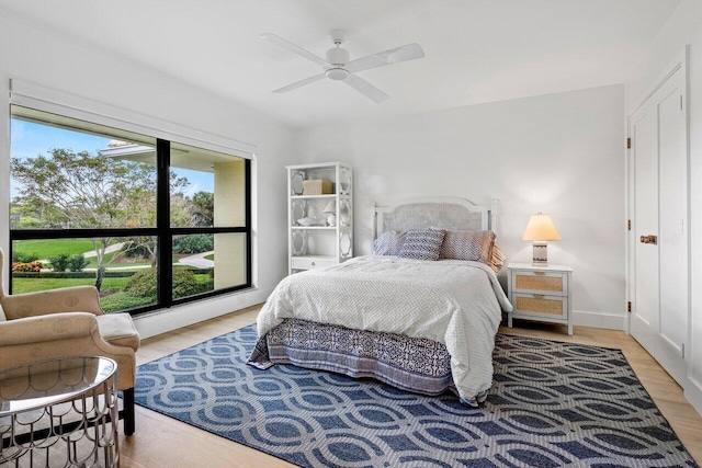 bedroom featuring ceiling fan and light hardwood / wood-style floors