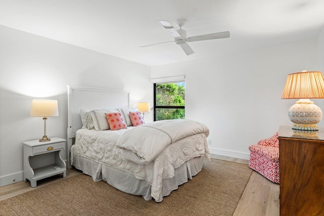 bedroom with wood-type flooring and ceiling fan