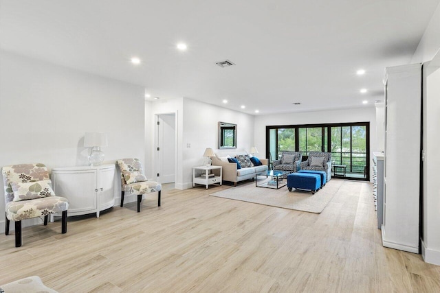 living room with light hardwood / wood-style floors