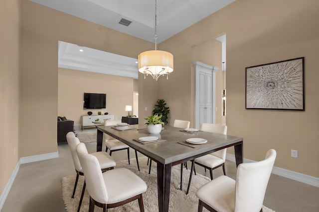 dining area featuring a tray ceiling