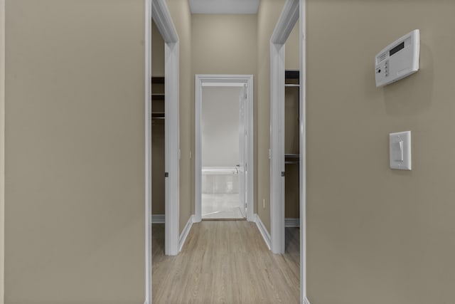 hallway featuring light hardwood / wood-style flooring