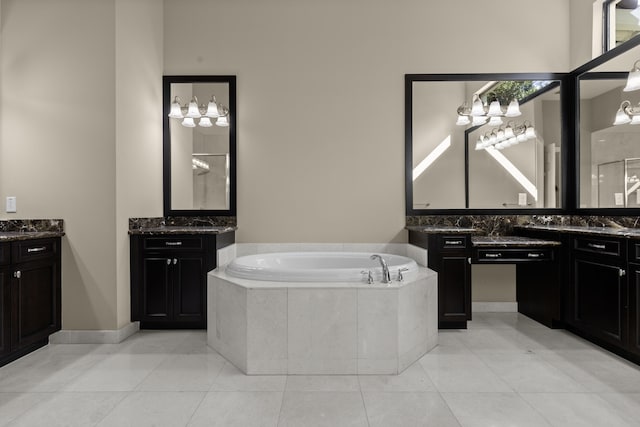 bathroom featuring tile patterned flooring, vanity, and independent shower and bath