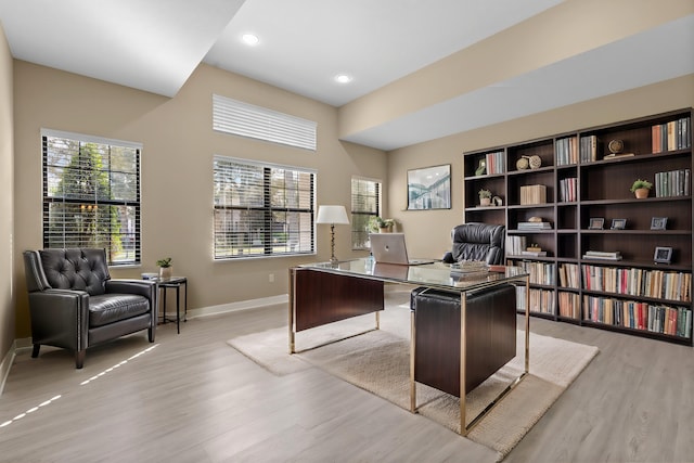 office area with light hardwood / wood-style flooring