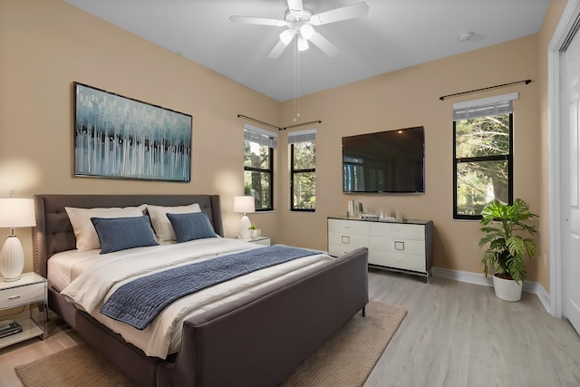 bedroom featuring ceiling fan and light hardwood / wood-style flooring