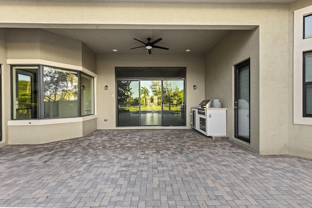 view of patio featuring ceiling fan and area for grilling