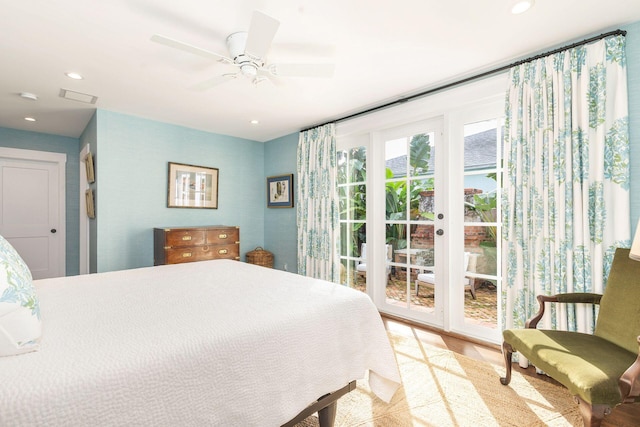 bedroom with ceiling fan, light hardwood / wood-style floors, and access to outside