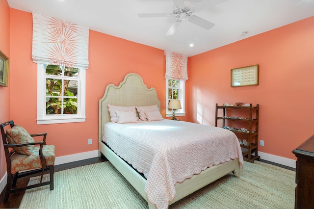 bedroom with hardwood / wood-style flooring and ceiling fan