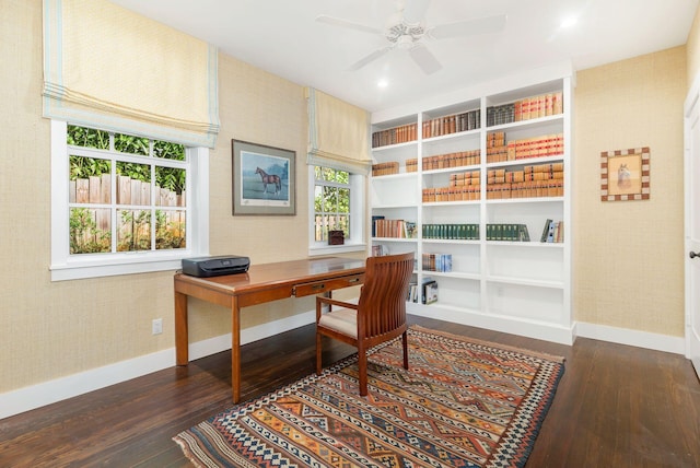 office area with ceiling fan and dark wood-type flooring