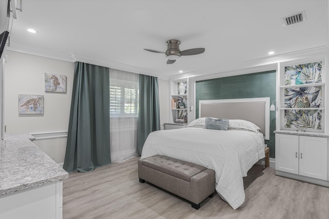 bedroom with light hardwood / wood-style floors, ceiling fan, and ornamental molding