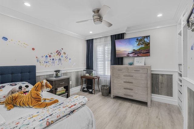 bedroom with ceiling fan, ornamental molding, and light hardwood / wood-style flooring