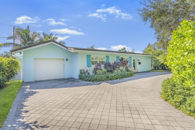 single story home featuring a garage