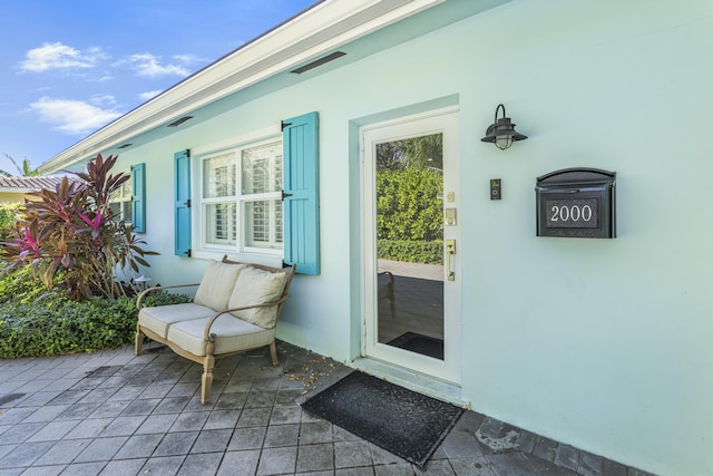 doorway to property with a porch