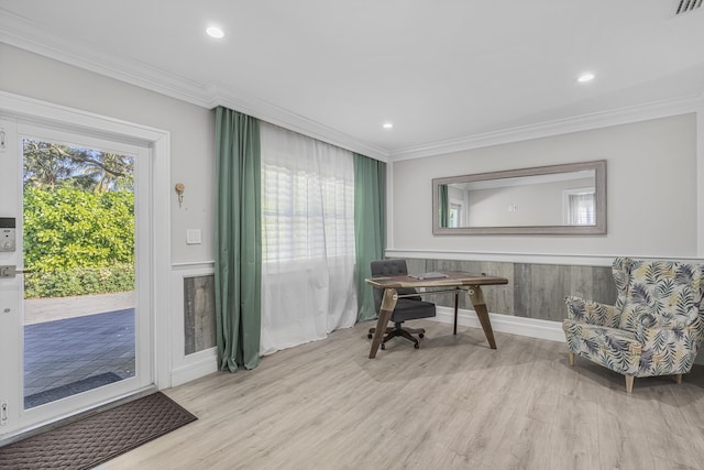 office area with light hardwood / wood-style flooring and crown molding