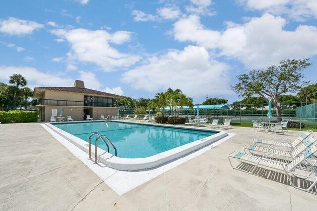 view of pool featuring a patio area