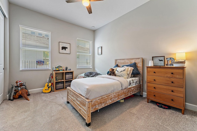 bedroom with light colored carpet and ceiling fan