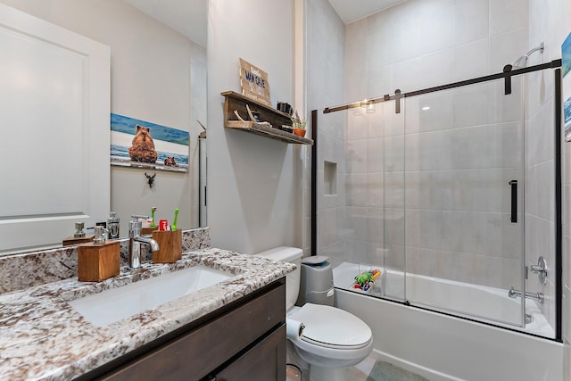 full bathroom with vanity, toilet, and enclosed tub / shower combo