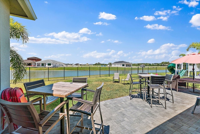 view of patio with a water view