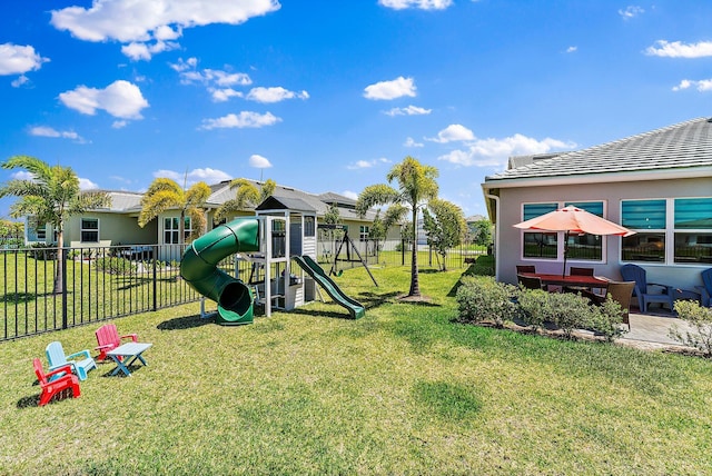 view of playground featuring a lawn