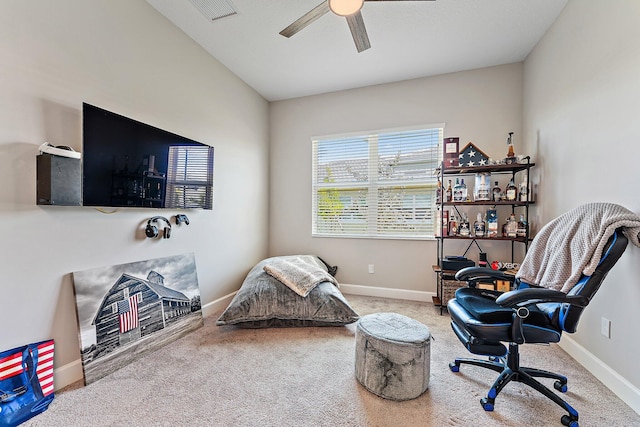 living area with carpet floors and ceiling fan