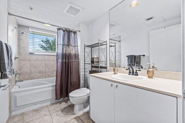 full bathroom featuring tile patterned flooring, a textured ceiling, toilet, shower / tub combo with curtain, and vanity