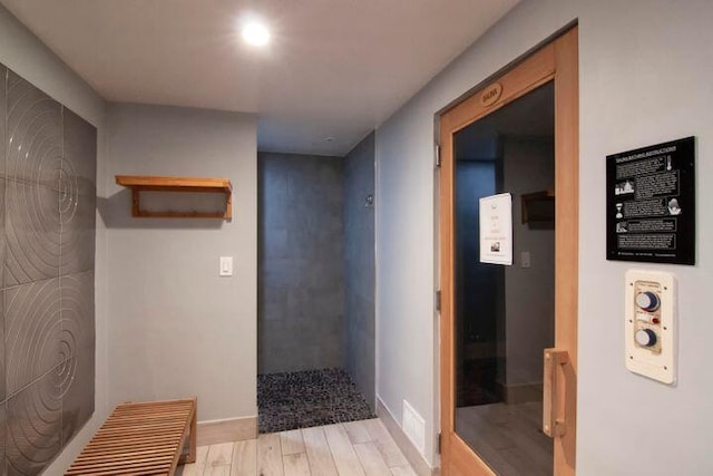 hallway with light hardwood / wood-style flooring