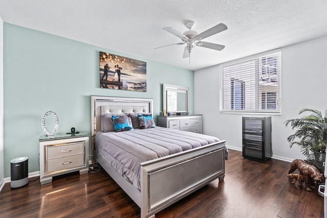 bedroom featuring multiple windows, a textured ceiling, dark hardwood / wood-style floors, and ceiling fan