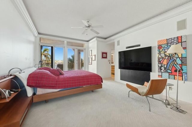 carpeted bedroom with ceiling fan and crown molding