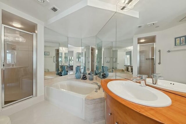 bathroom with tile patterned flooring, vanity, and independent shower and bath