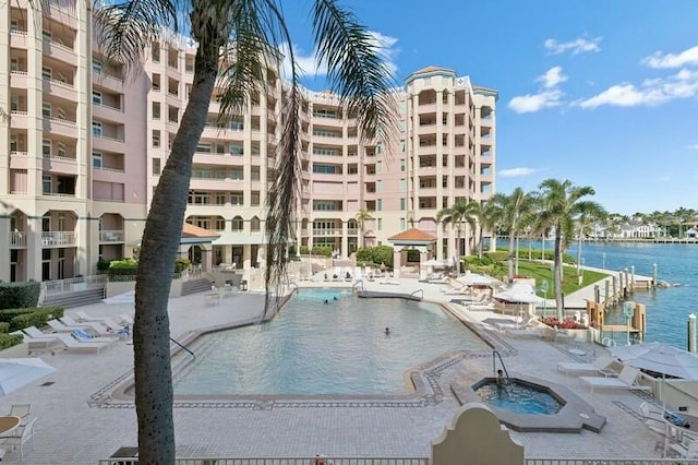 view of pool featuring a water view