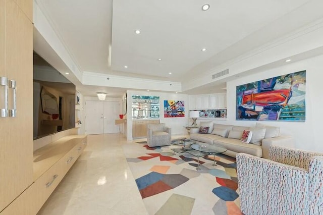 living room with ornamental molding