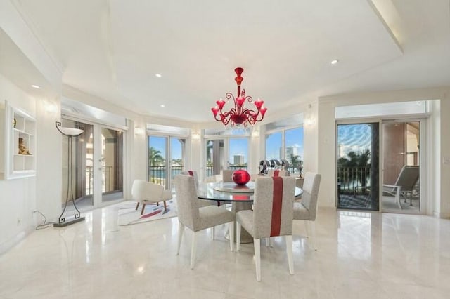 dining space featuring french doors and a chandelier