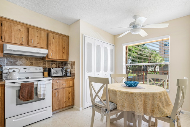 kitchen featuring ceiling fan, white electric stove, backsplash, a textured ceiling, and light tile patterned flooring