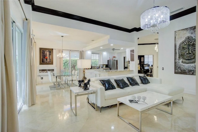 living room with ornamental molding and a notable chandelier