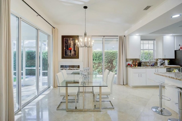 dining space featuring a chandelier