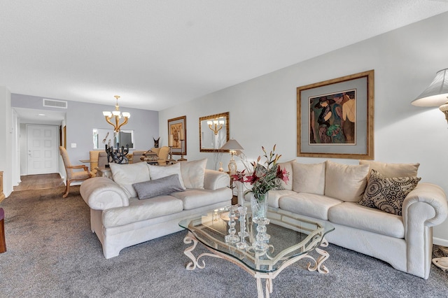 carpeted living room featuring a chandelier