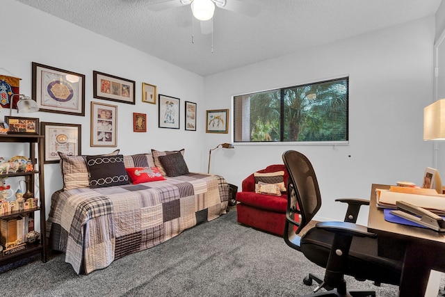 bedroom featuring ceiling fan, carpet floors, and a textured ceiling