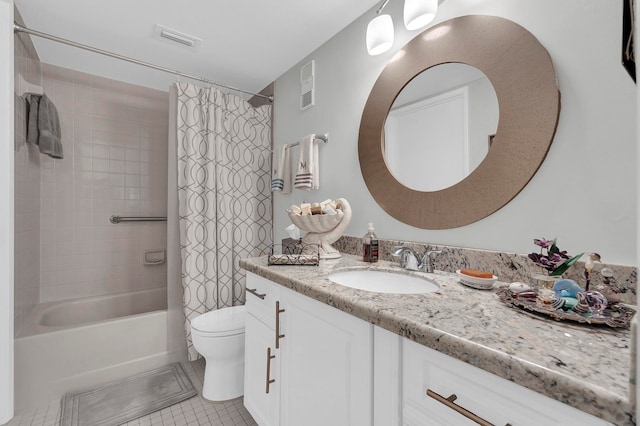 full bathroom with tile patterned floors, vanity, shower / tub combo, and toilet