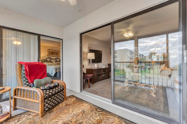 interior space with ceiling fan