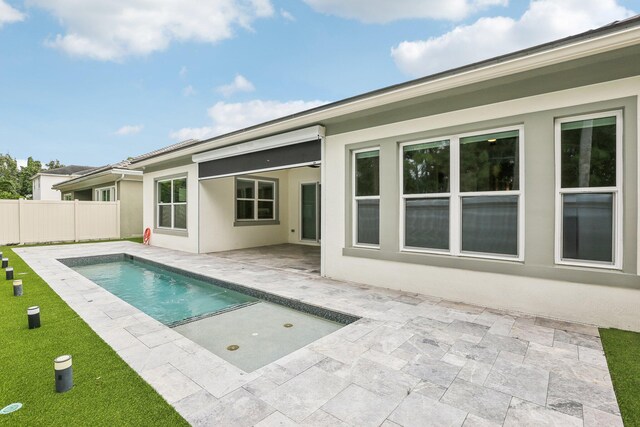 rear view of house with a patio