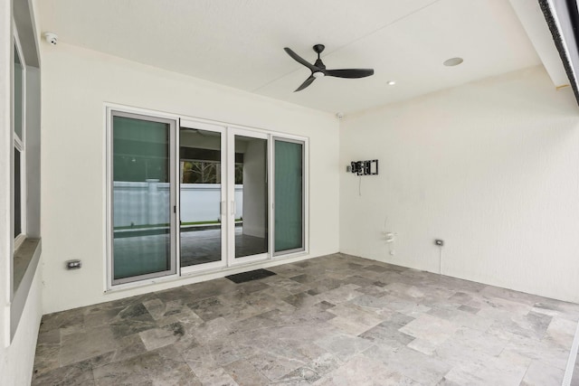 view of patio / terrace featuring ceiling fan and french doors